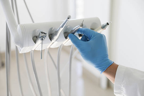 Professional Tooth Extraction technician working in Mission Bend, TX
